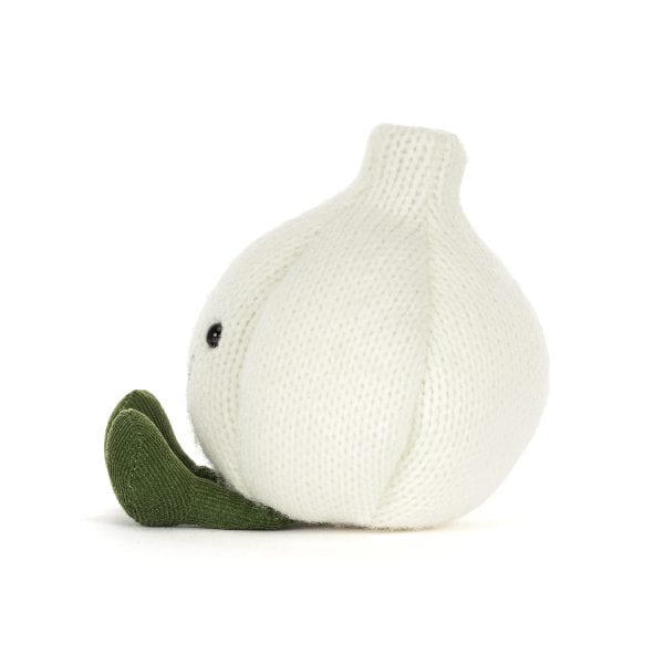 A knitted garlic plush toy in off-white with a dark green stem and leaf, featuring a small black bead eye, shown on a plain white background.