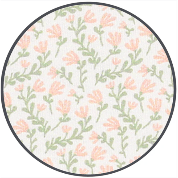Round fabric swatch with floral pattern on a white background