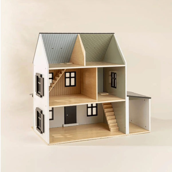 Wooden dollhouse with a white exterior and gray roof on a plain background